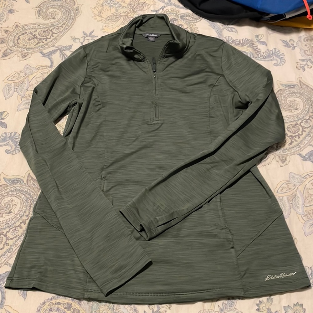 Green Eddie Baurer runners cover. Thumb holes
